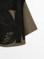 Flowing blouse with contrasting ribbons