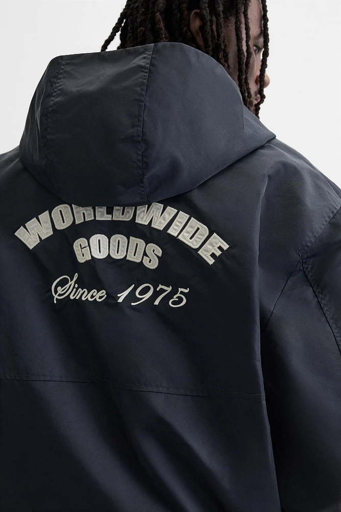 HOODED TECHNICAL JACKET