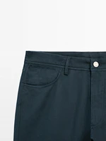 Faux jean tapered fit en coton mélangé