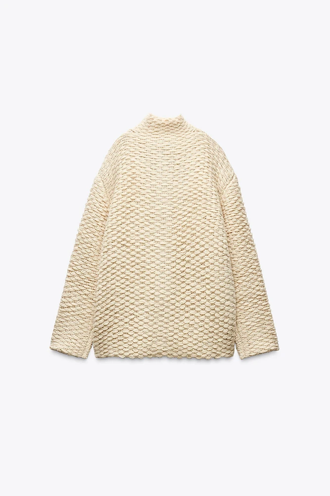 MANTEAU EN MAILLE À COL MONTANT