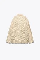 MANTEAU EN MAILLE À COL MONTANT