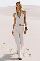TOP HALTER SURPIQUÉ