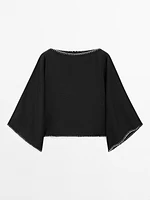 Cape blouse with batwing sleeves