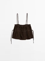 Gathered suede leather top with straps