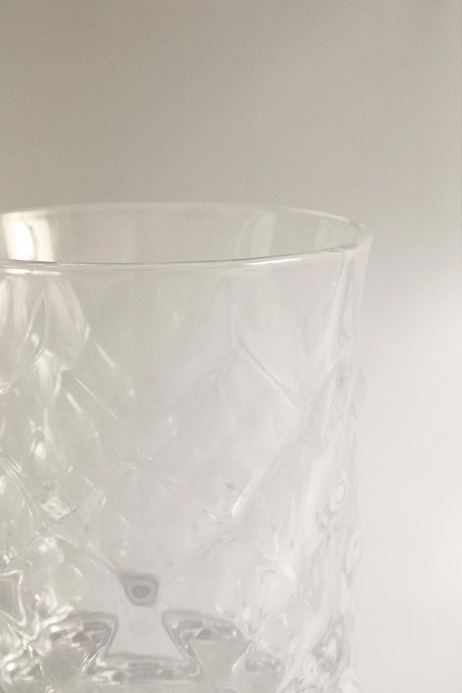 CRYSTALLINE TUMBLER WITH RAISED DESIGN
