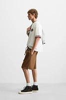 BERMUDA DE JOGGING COUTURES