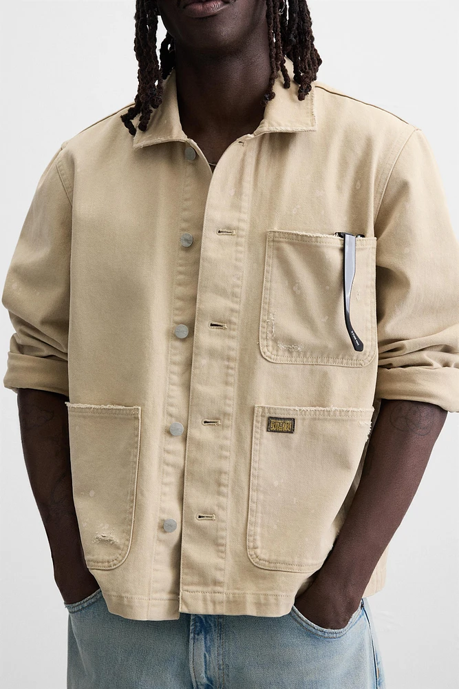 VESTE DÉLAVÉE À ÉCLABOUSSURES