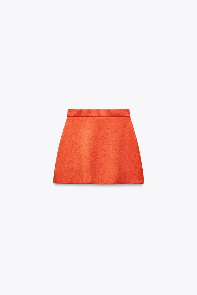 MINI JUPE EN MAILLE UNIE