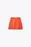 MINI JUPE EN MAILLE UNIE