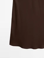 Jupe midi fluide en tissu satiné