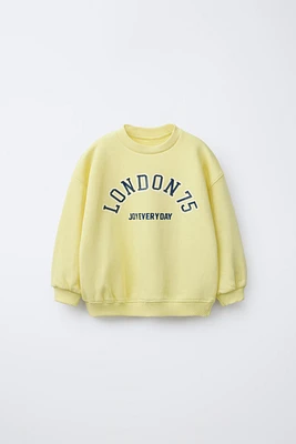 RAISED TEXT SWEATSHIRT