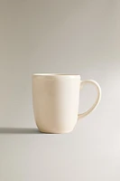 EARTHENWARE MUG WITH A RAISED-DESIGN EDGE