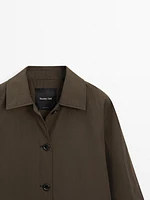 Trench tissu technique boutonnage