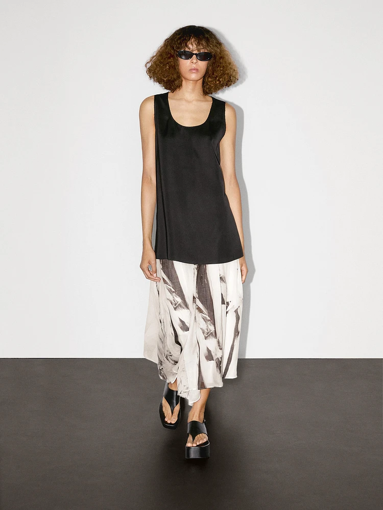 Long sleeveless satin blouse