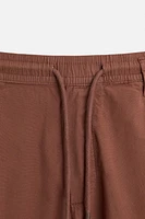 PLEATED POPLIN PANTS