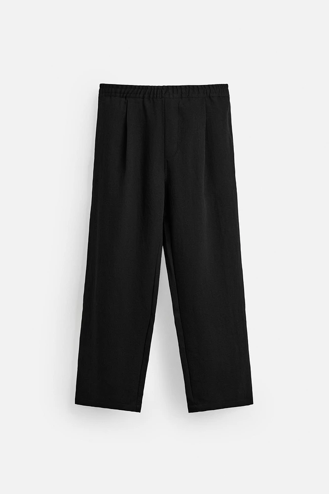 FLOWY PLEATED PANTS