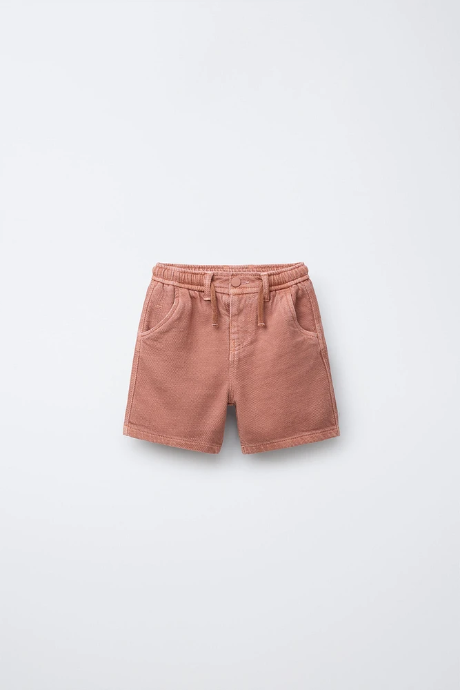BERMUDA STANDARD TOUCHER DOUX