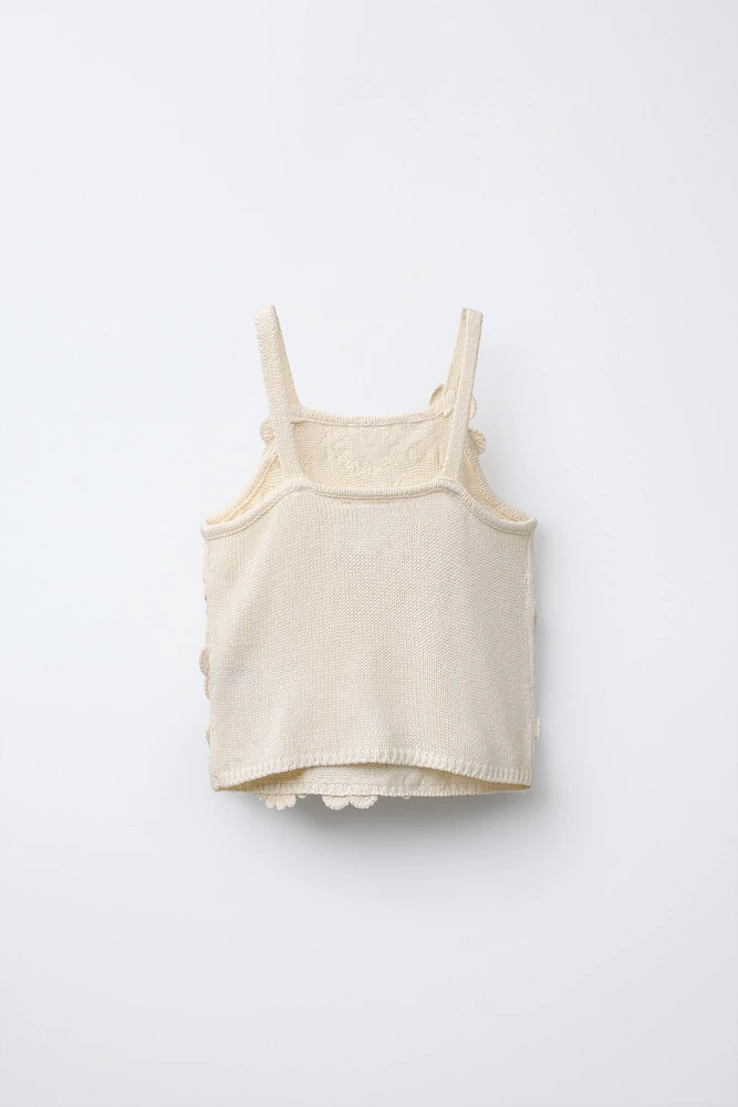 TOP EN MAILLE AVEC VERROTERIES