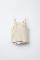 TOP EN MAILLE AVEC VERROTERIES
