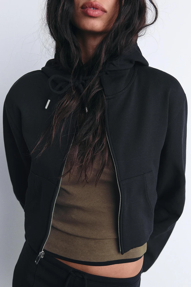 CROPPED INTERLOCK SWEATSHIRT