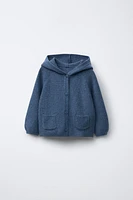 GILET EN MAILLE À CAPUCHE