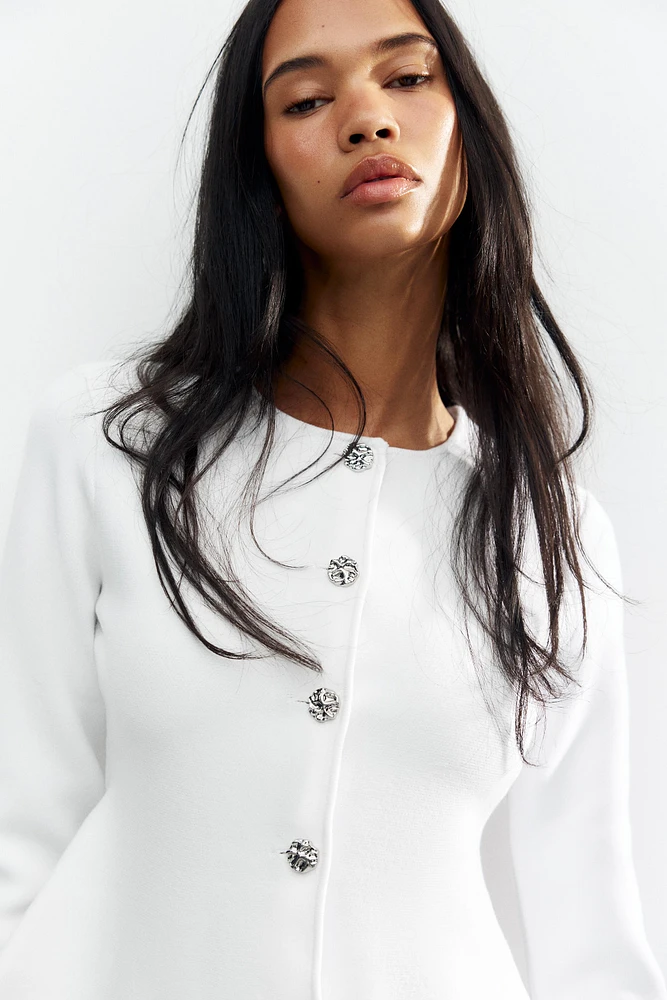GILET PEPLUM EN MAILLE FINE