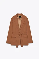 VESTE OVERSIZE À CEINTURE