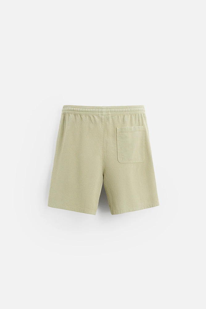 TEXTURED EMBROIDERED SHORTS