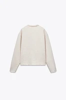 PULL AU TOUCHER DOUX