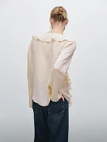 Ruffled blouse with asymmetric hem