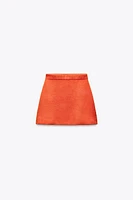 MINI JUPE EN MAILLE UNIE
