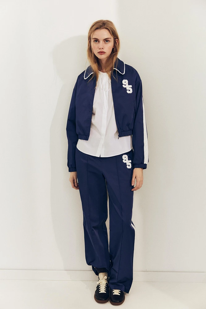 VESTE SATINÉE BANDE LATÉRALE