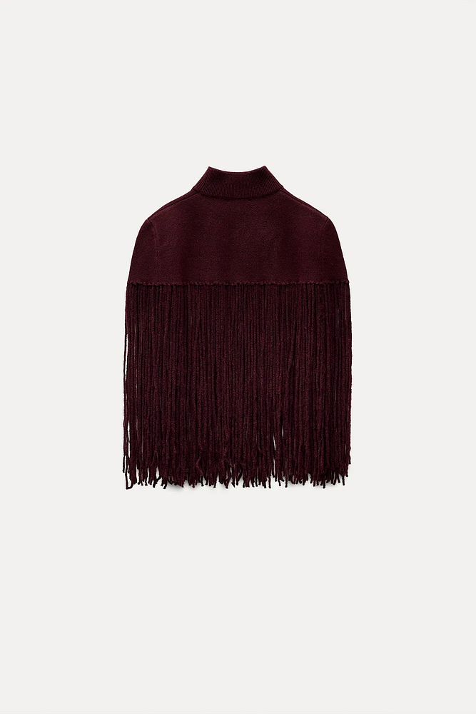 CAPE EN MAILLE AVEC FRANGES