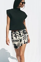 PRINTED BUCKLE MINI SKIRT