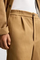 PLEATED FAUX SUEDE SHORTS