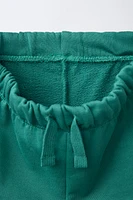 TEXT PLUSH SHORTS