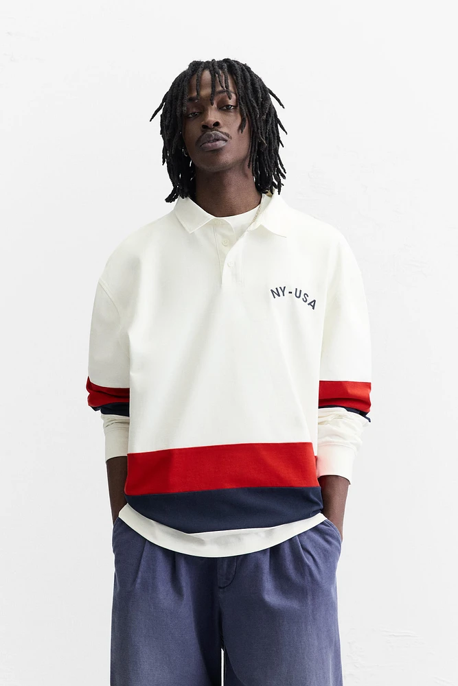 POLO À BANDES EN CONTRASTE