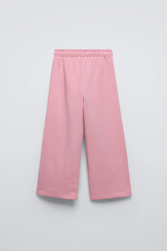PANTALON À JAMBES LARGES EN MOLLETON AVEC INSCRIPTION