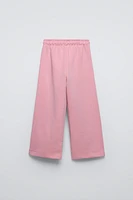PANTALON À JAMBES LARGES EN MOLLETON AVEC INSCRIPTION
