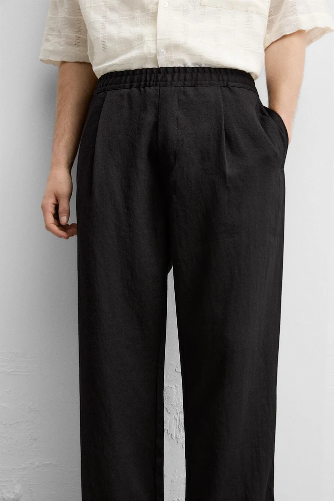 FLOWY PLEATED PANTS