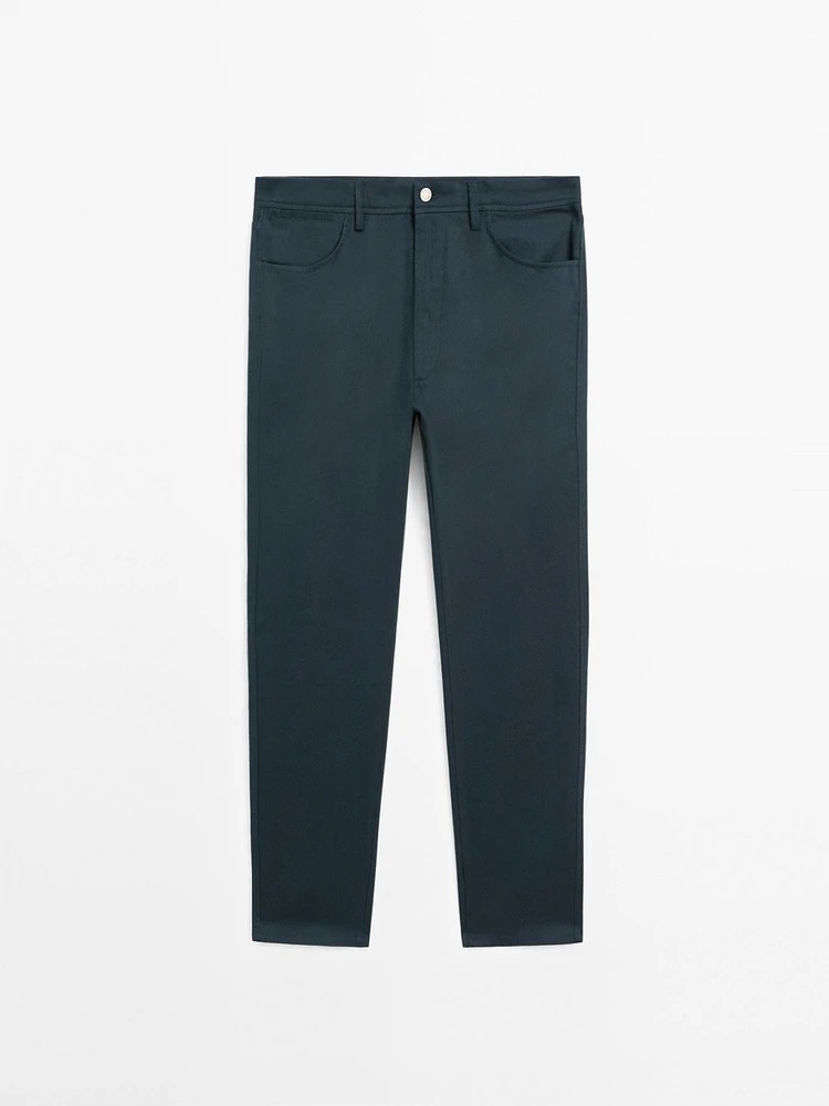 Faux jean tapered fit en coton mélangé