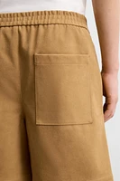 PLEATED FAUX SUEDE SHORTS