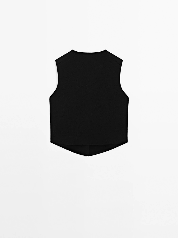 Veste sans manches en maille boutons fantaisie