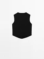 Veste sans manches en maille boutons fantaisie