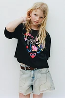 SHORT EN DENIM DÉCHIRÉ ET BRILLANT