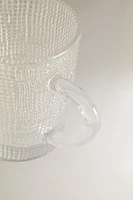 GLASS CUP WITH RAISED DESIGN