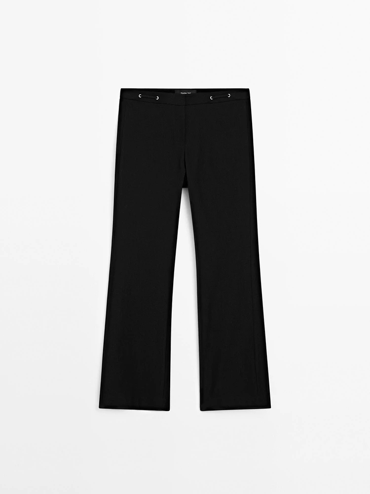 Flared trousers with waist detail