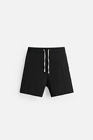 WRINKLED EFFECT JACQUARD BERMUDA SHORTS
