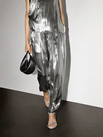 Flowing metallic trousers with gathered detail