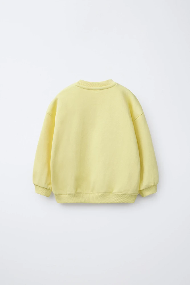RAISED TEXT SWEATSHIRT